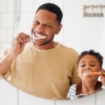 allergy toothpaste oral immunotherapy treatment father and son brush their teeth